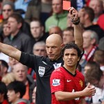 Manchester United's Rafael Da Silva is shown a red card by referee Howard Webb