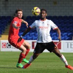 CHESTER, ENGLAND - APRIL 07:  (THE SUN OUT, THE SUN ON SUNDAY OUT) Joe Maguire of Liverpool and Moussa Dembele of Fulham in action during the U21 Premier League game between Liverpool and Fulham at The Swansway Chester Stadium on April 7, 2015 in Chester, England.  (Photo by Nick Taylor/Liverpool FC via Getty Images)
