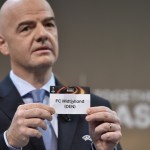 UEFA General Secretary  Gianni Infantino shows the name of FC Midtjylland football club during  the draw for  the UEFA Europa league round of sixteen, on December 14, 2015 at the UEFA headquarters in Nyon.  AFP PHOTO / FABRICE COFFRINI / AFP / FABRICE COFFRINI        (Photo credit should read FABRICE COFFRINI/AFP/Getty Images)