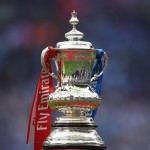 FA_Cup_trophy_with_Emirates_red_and_blue_ribbons11544110861549_medium